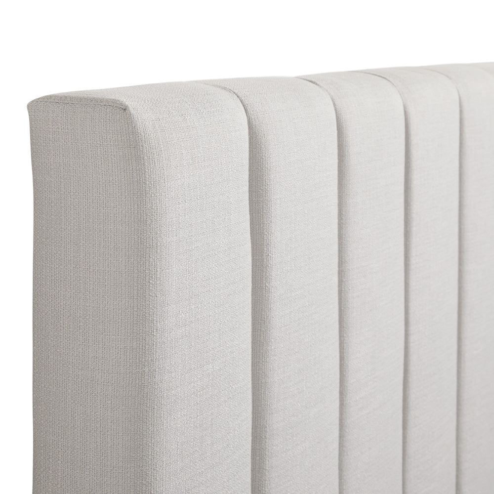 Close-up of Xcella Channel Upholstery Bed frame showcasing its stylish tufted headboard and sleek fabric upholstery.