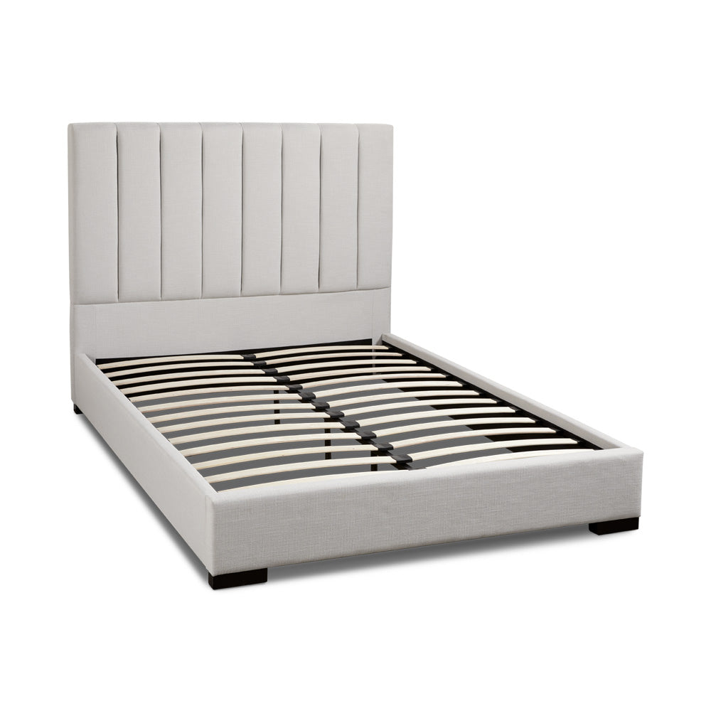 Xcella Channel Upholstery Bed with slatted bed frame and padded headboard in a modern bedroom setting.