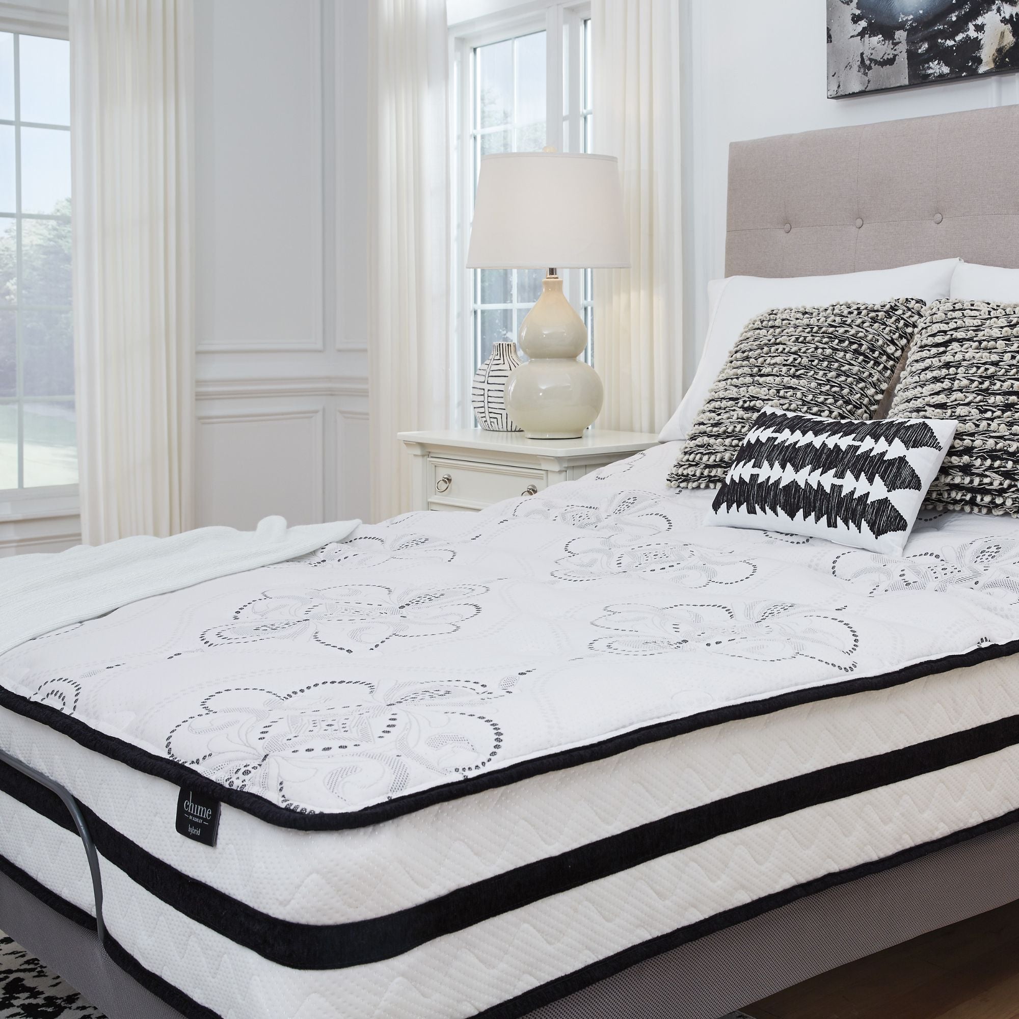 Signature Ashley Chime 10-inch ultra plush hybrid mattress with soft fabric cover and plush top, showcasing its luxurious comfort.