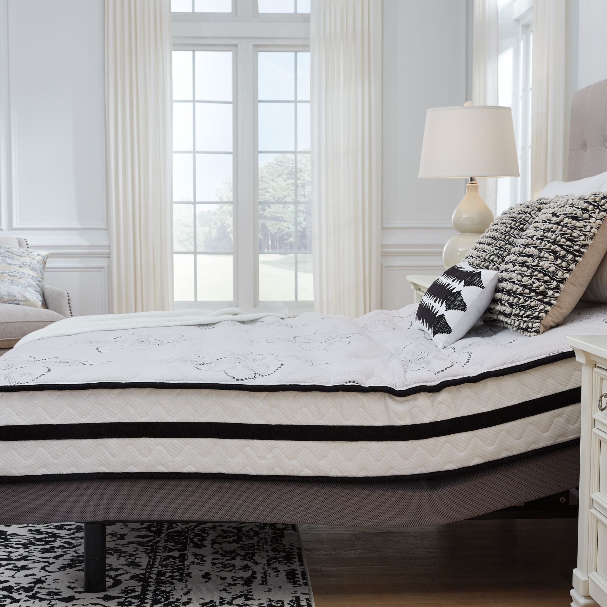 Signature Ashley Chime 10-inch ultra plush hybrid mattress with soft, quilted surface and supportive layers, perfect for comfort and rest.