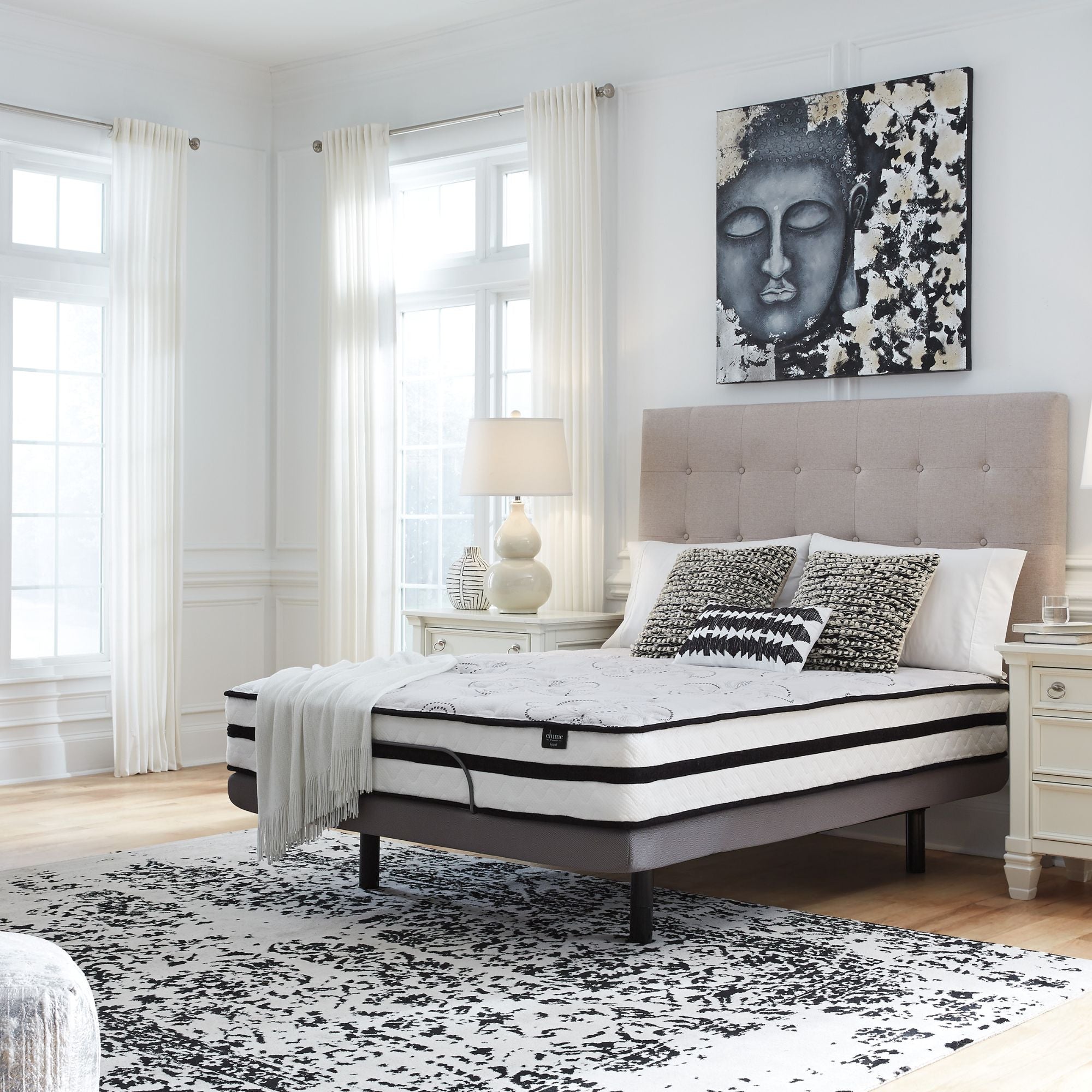 Signature Ashley Chime 10-inch ultra plush hybrid mattress with soft quilted surface and supportive layers in a bedroom setting.