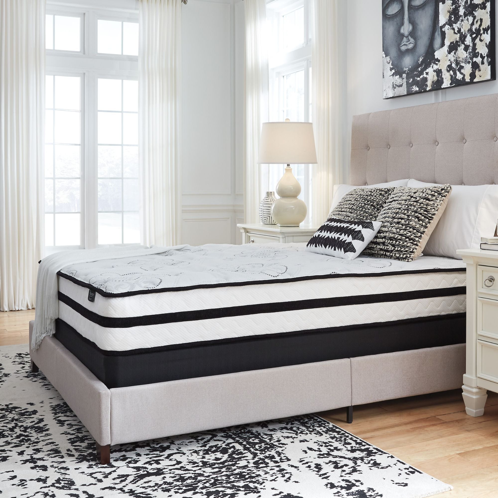 Signature Ashley Chime 10-inch ultra plush hybrid mattress with a soft, quilted top and supportive layers for comfort and durability.