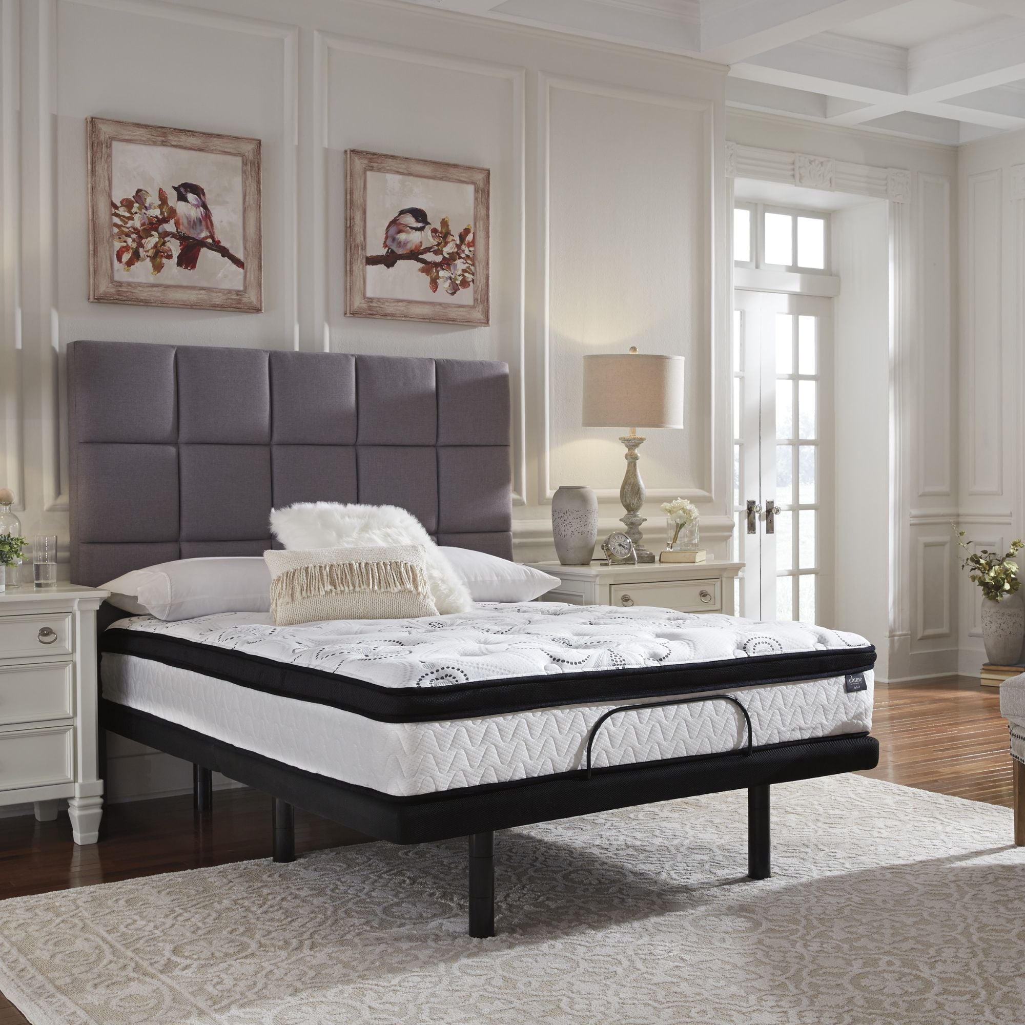 Signature Ashley Chime 12-inch ultra plush hybrid mattress with quilted top and supportive layers, showcasing a comfortable sleeping surface.