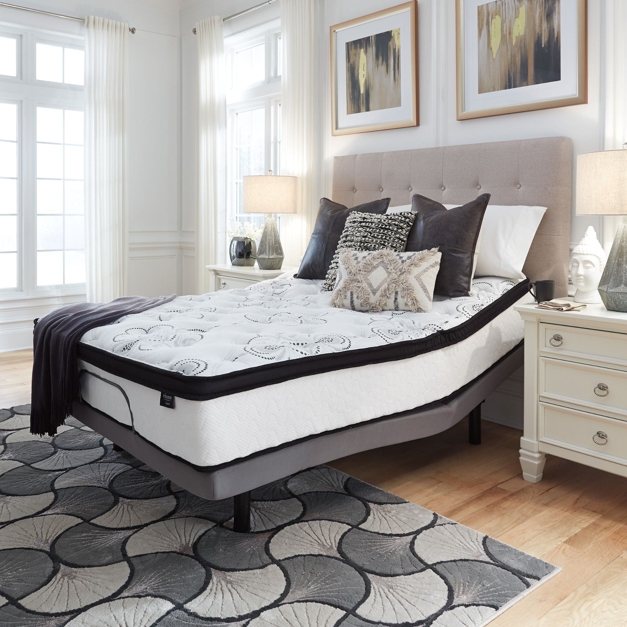 Signature Ashley Chime 12-inch ultra plush hybrid mattress with a soft, cushioned surface and supportive base in a bedroom setting.