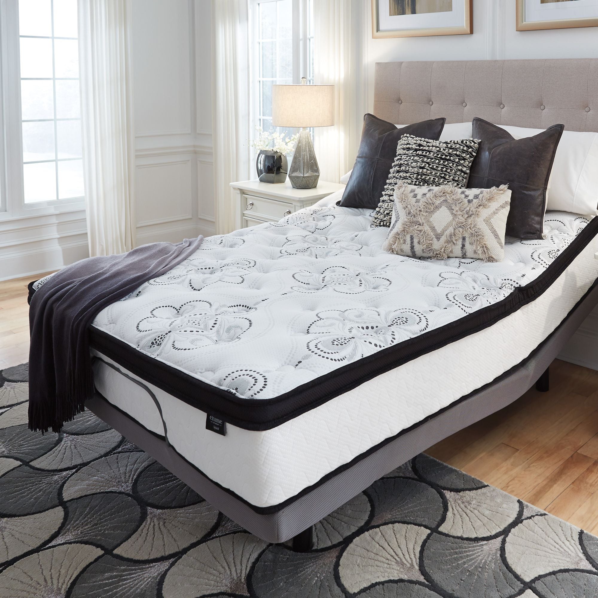Signature Ashley Chime 12-inch ultra plush hybrid mattress showing its soft, plush surface with memory foam and pocket coil layers.