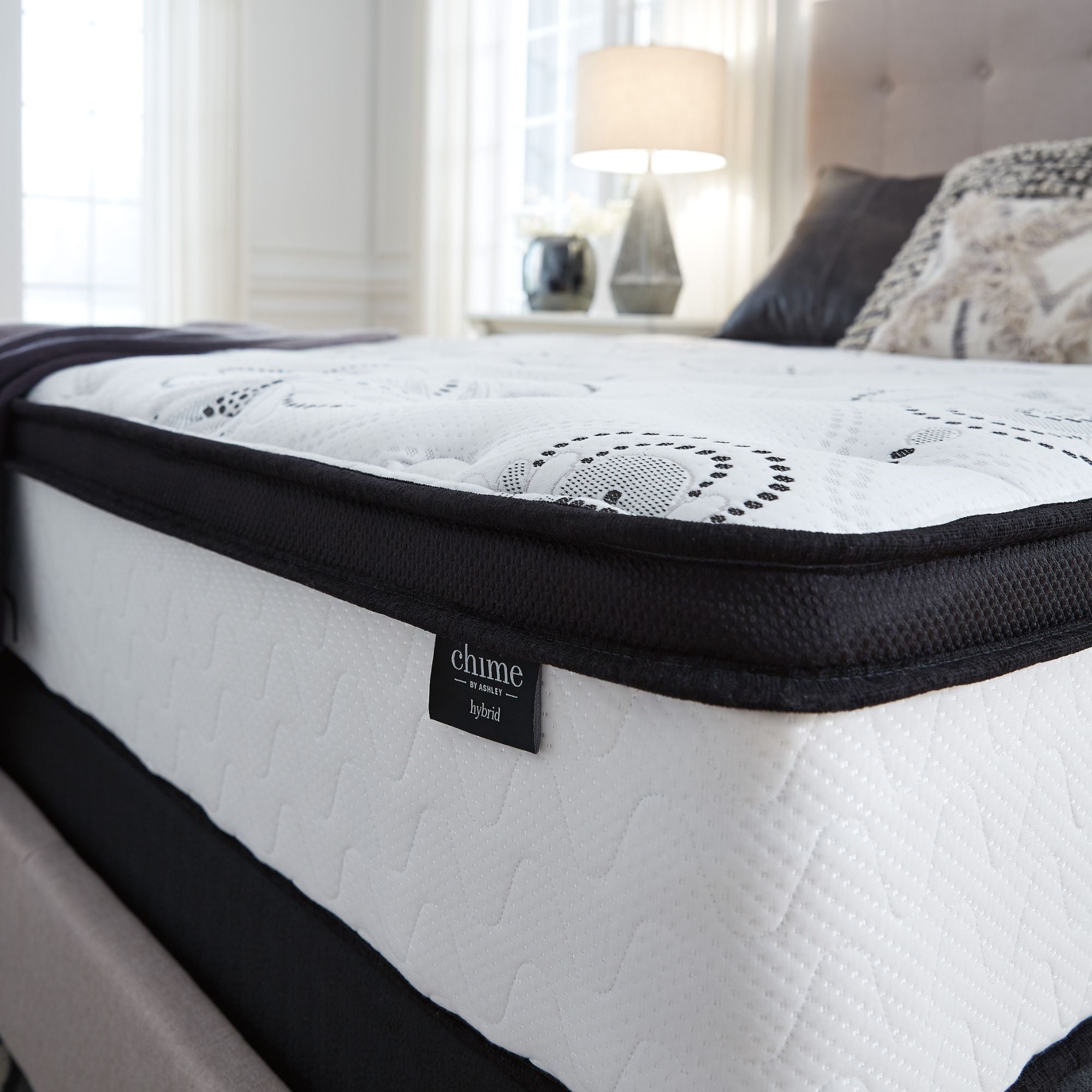 Signature Ashley Chime 12-inch ultra plush hybrid mattress with soft fabric cover and plush surface, ideal for comfortable sleep.