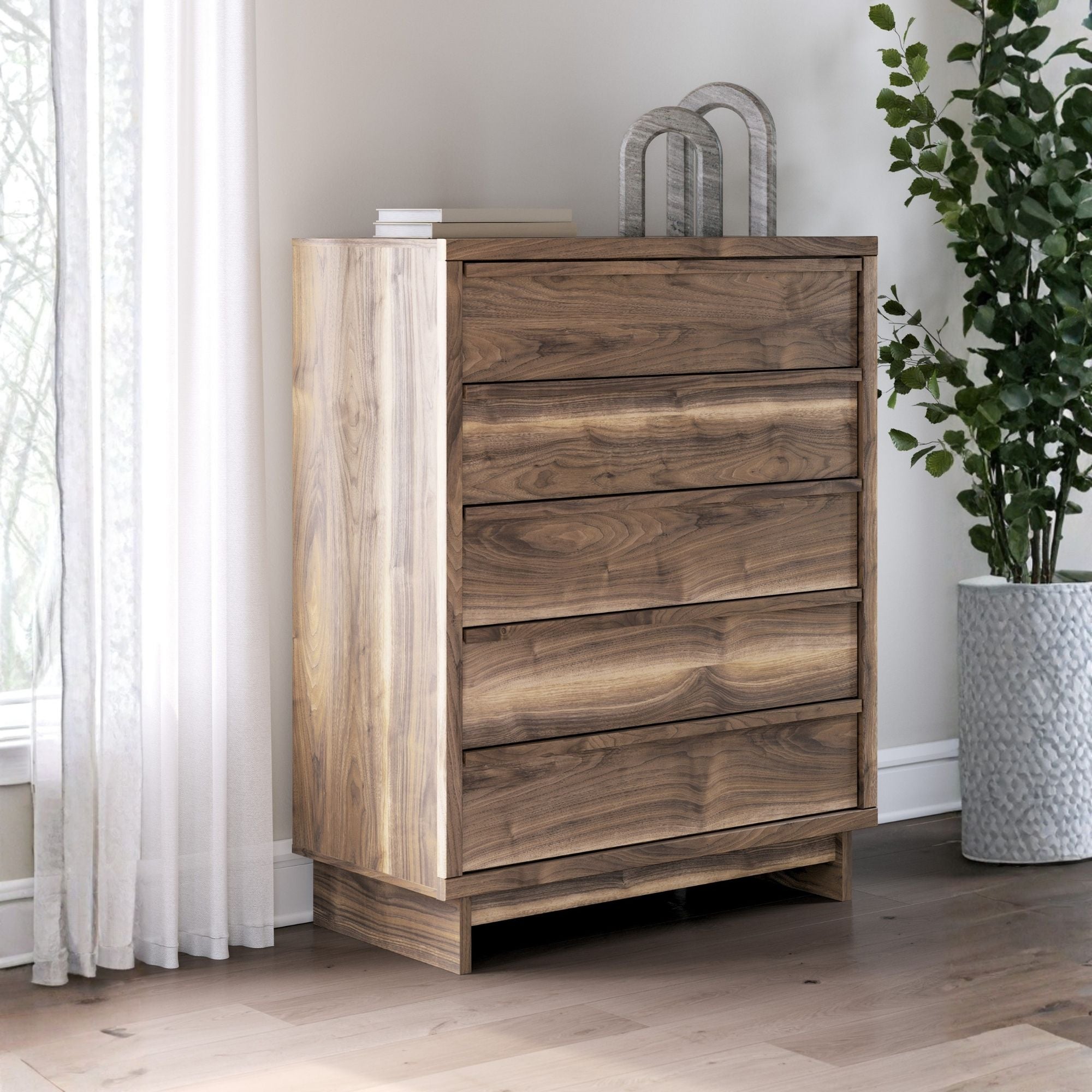 Signature Ashley Chirason four-drawer chest with wood finish and modern design, showcasing sleek drawer handles and sturdy construction.