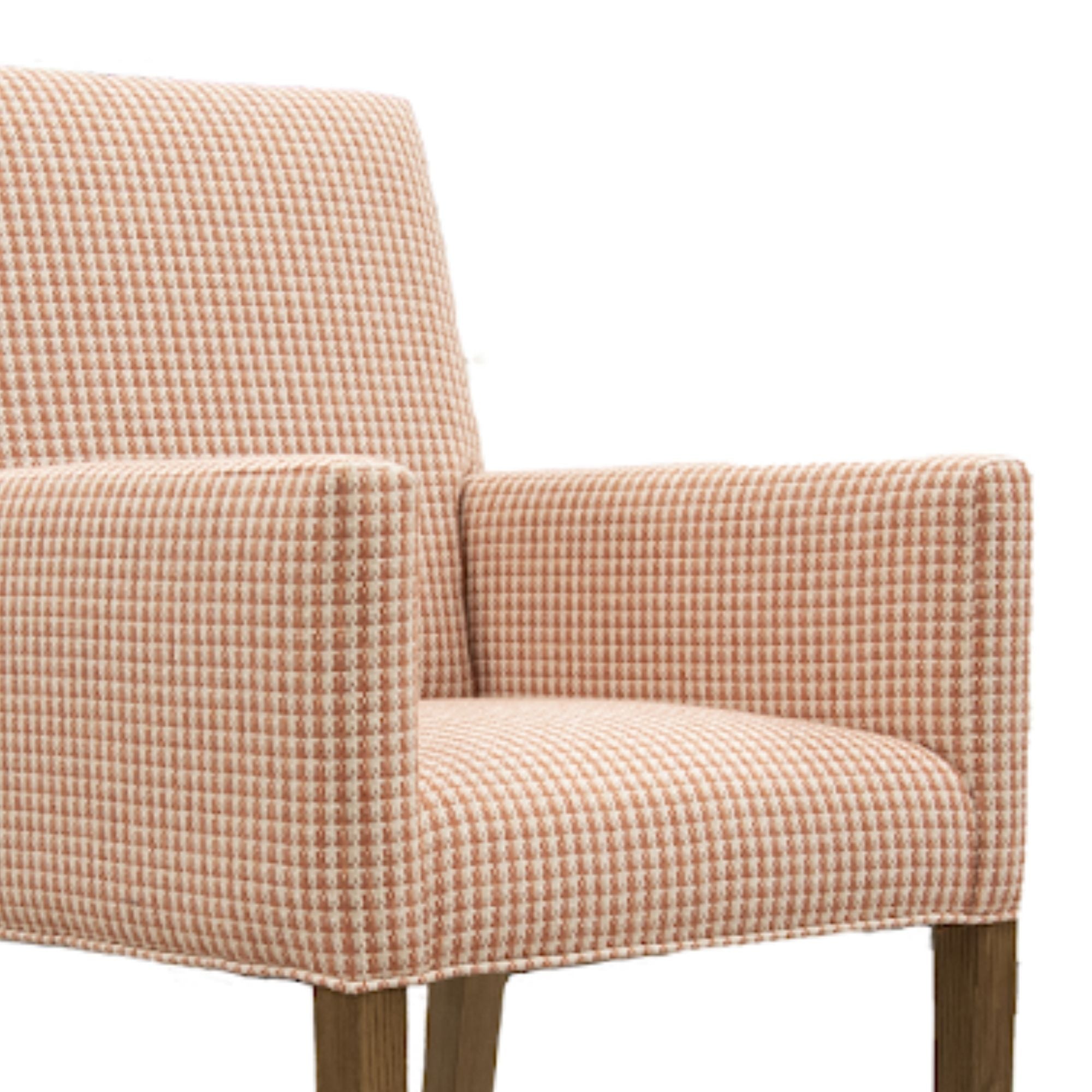 ComfortStyle Canadian-made Chloe accent chair with plush fabric and modern design, shown from a side angle in a cozy living room setting.