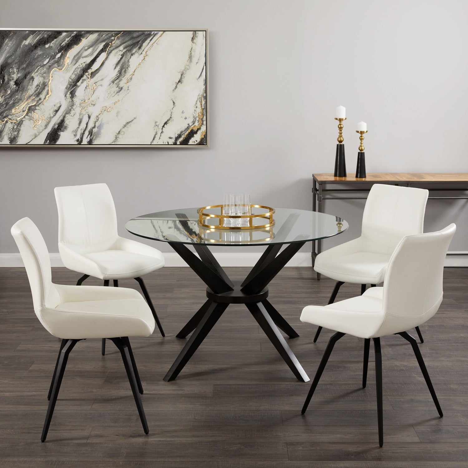 Pair of Xcella Nona swivel dining chairs with white PU seats and black legs, shown from a side angle in a modern dining room setting.