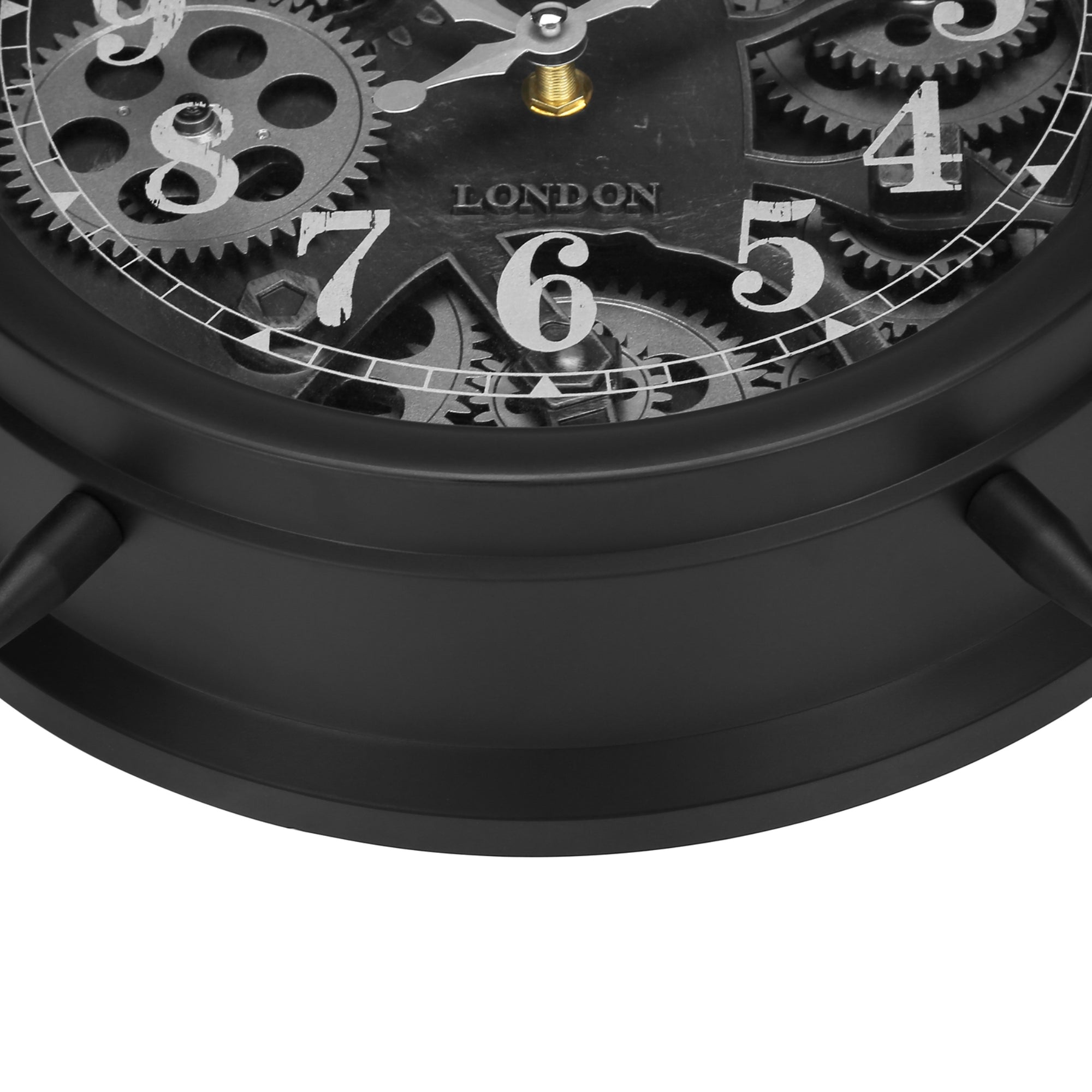 Black table top clock with visible gear mechanism from Monarch Specialties, showcasing a modern clock design with intricate gear details.
