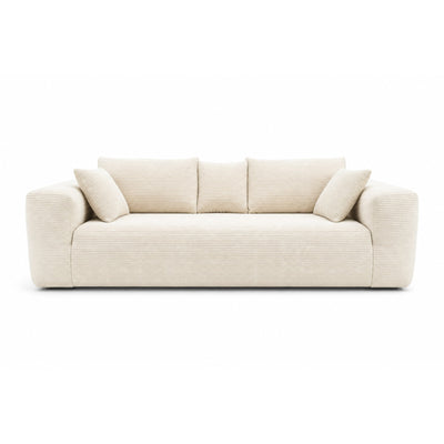 Ivory low-profile compression sofa by Taste Living, showcasing sleek modern design and comfortable cushioning in a contemporary living space.