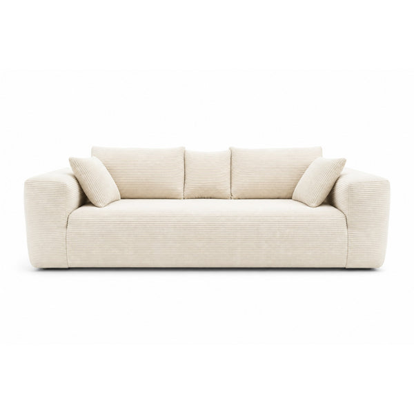 Ivory low-profile compression sofa by Taste Living, showcasing sleek modern design and comfortable cushioning in a contemporary living space.