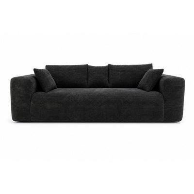 Black low-profile compression sofa by Taste Living with sleek, modern design and comfortable cushioning.