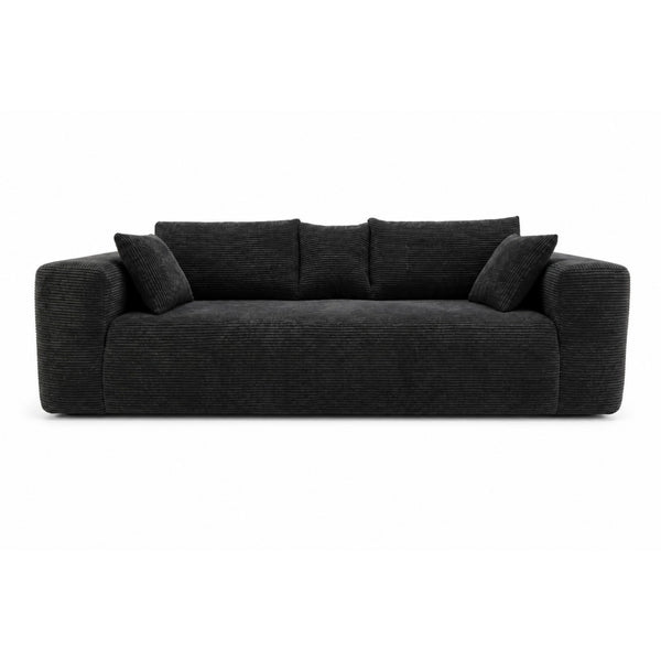 Black low-profile compression sofa by Taste Living with sleek, modern design and comfortable cushioning.