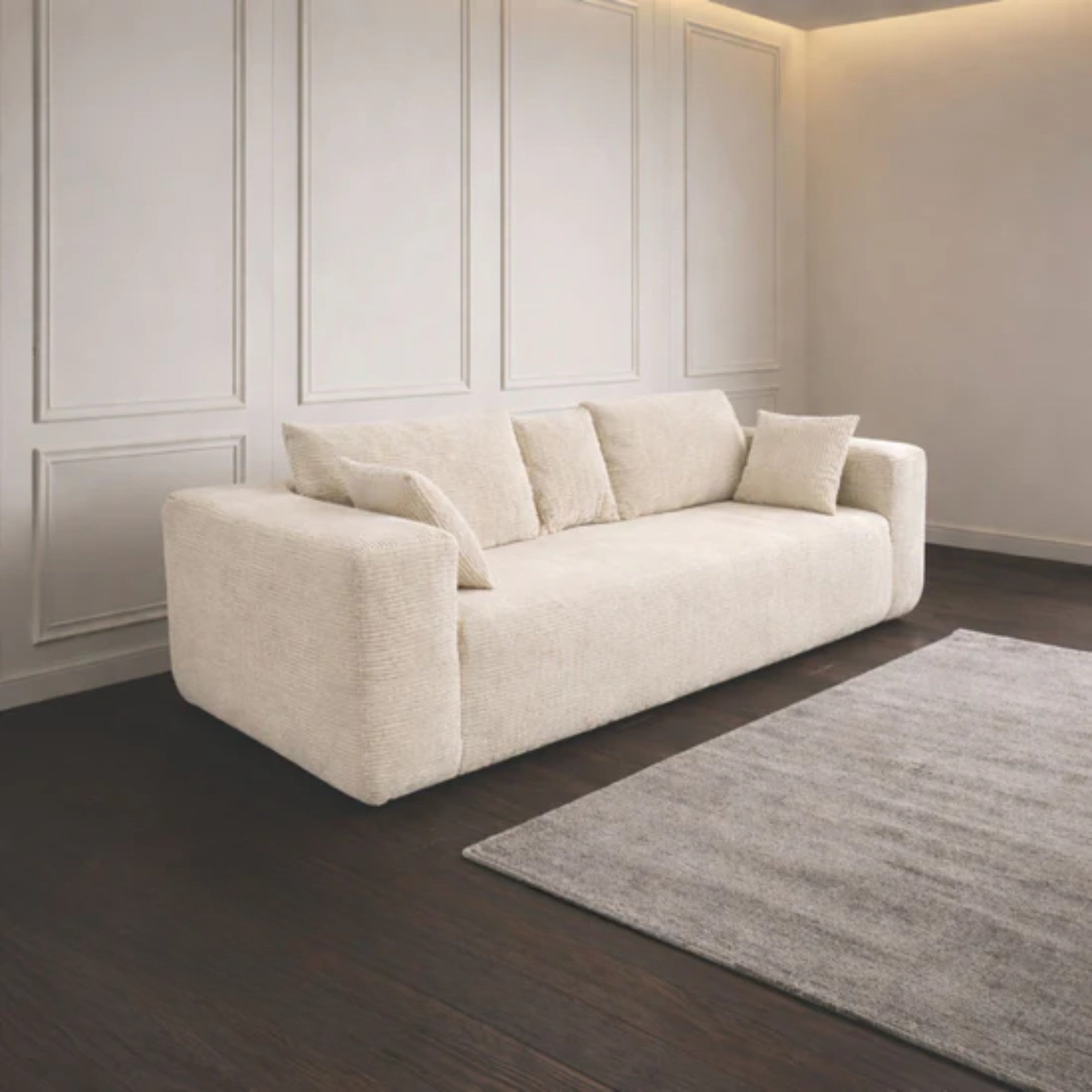Ivory low-profile compression sofa by Taste Living with sleek, modern design and plush cushioning for stylish comfort.