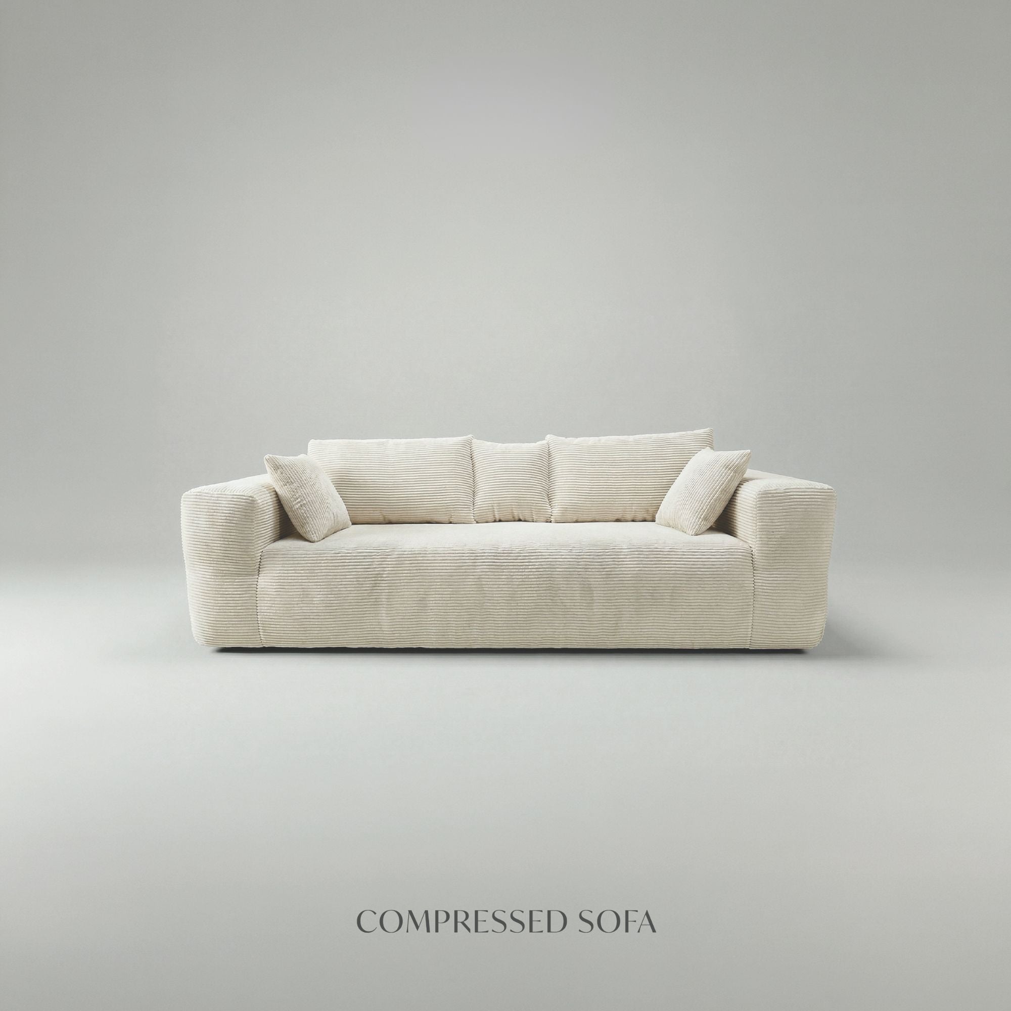 Low-profile ivory compression sofa by Taste Living with sleek design and plush cushioning, perfect for modern living rooms.