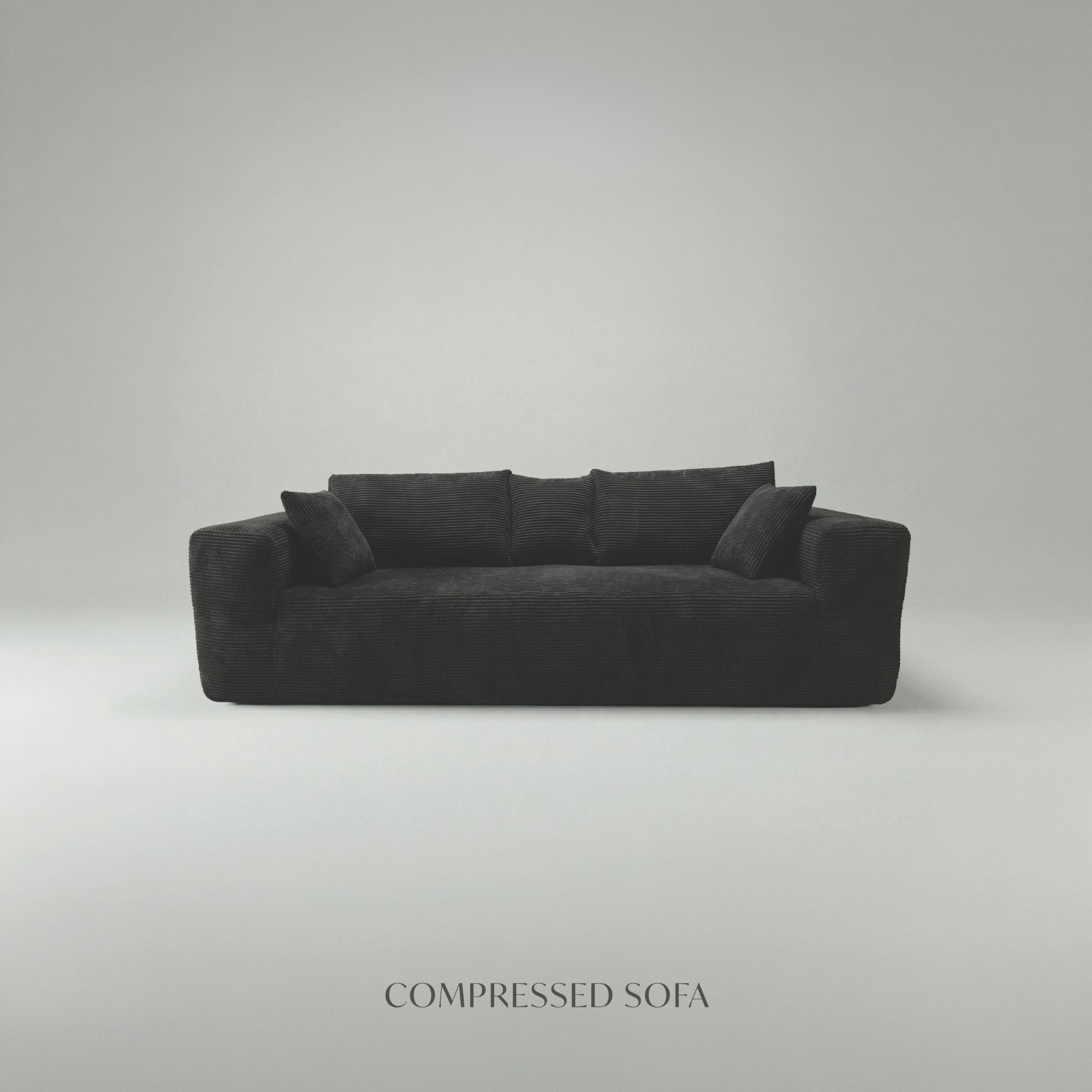 Black low-profile compression sofa by Taste Living, showcasing its sleek design and comfortable seating in a modern living space.