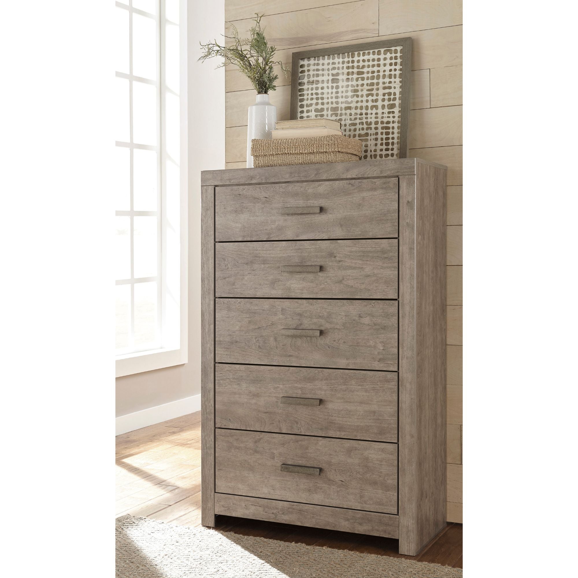 Signature Ashley Culverbach Grey Chest showing a sleek, modern bedroom storage chest with a smooth finish and sturdy design.
