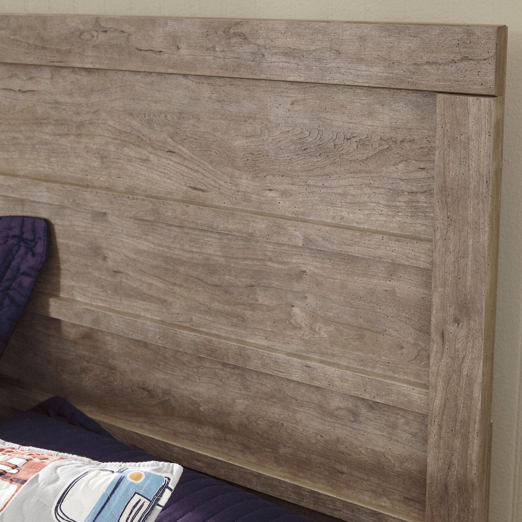 Gray Culverbach bed from Signature Ashley, showcasing a stylish bedroom setup with a plush upholstered headboard and coordinated bedding.