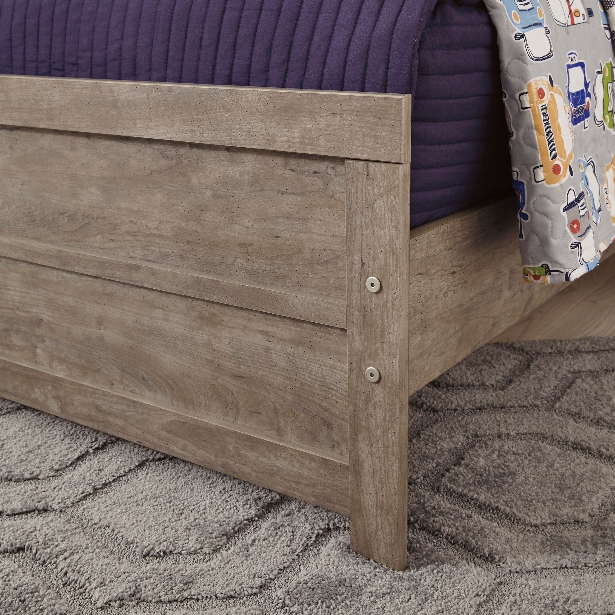 Grey Culverbach bed from Signature Ashley with a modern upholstered headboard and clean-lined frame in a bedroom setting.