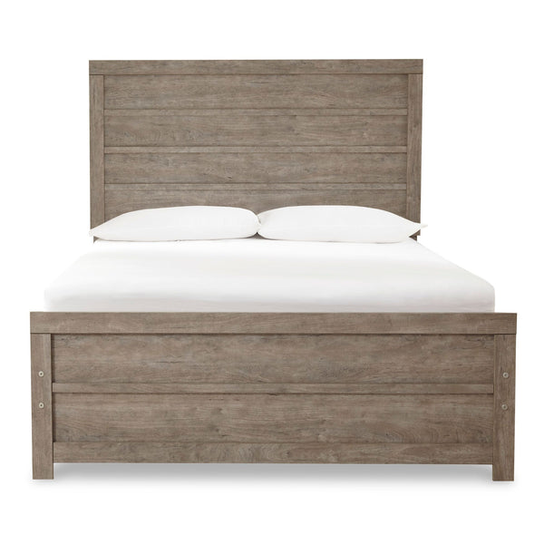 Grey Culverbach bed from Signature Ashley, showcasing a stylish bedroom setup with a plush upholstered headboard and matching bedding.