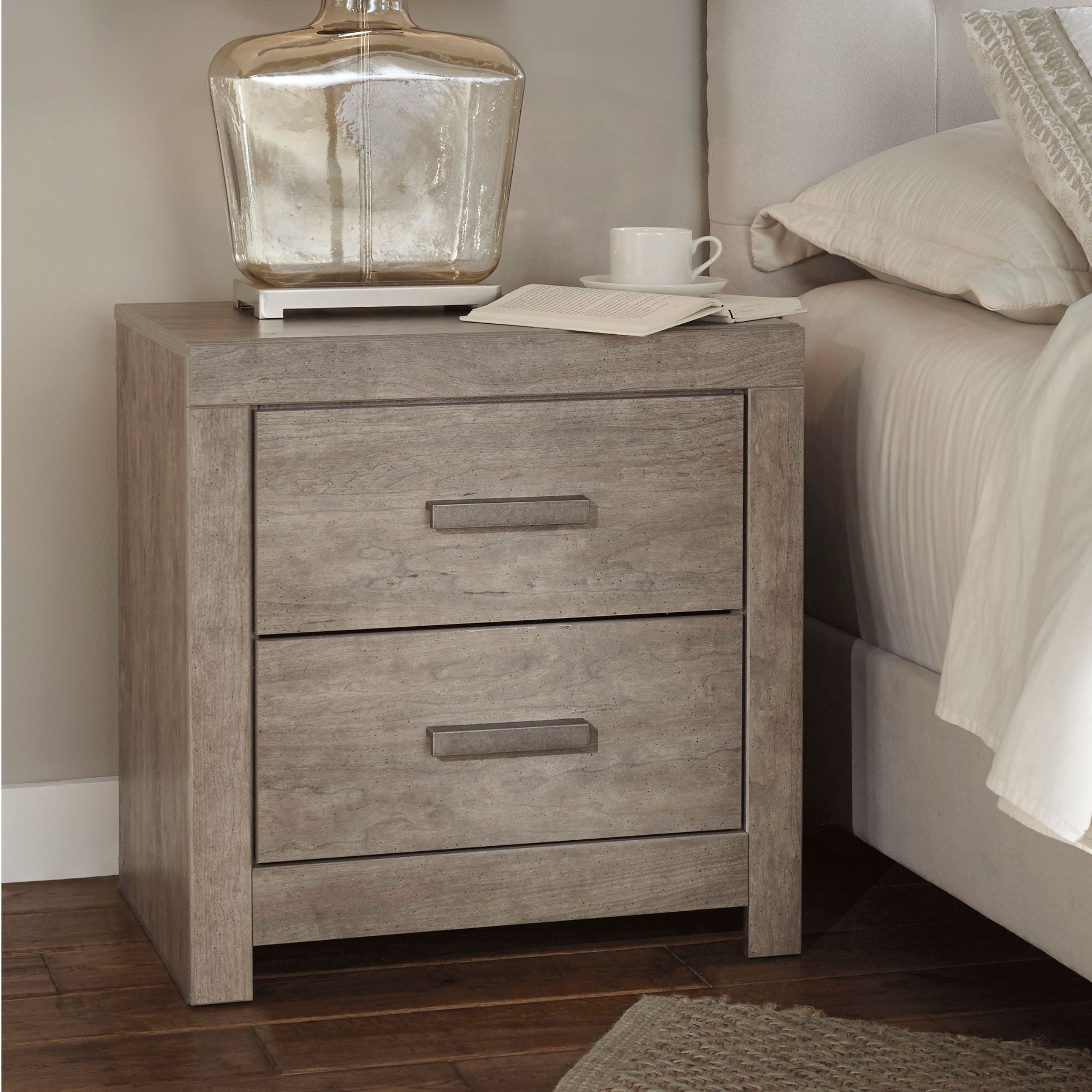 Gray Culverbach nightstand from Signature Ashley, showing a modern bedroom nightstand with clean lines and a sleek design.