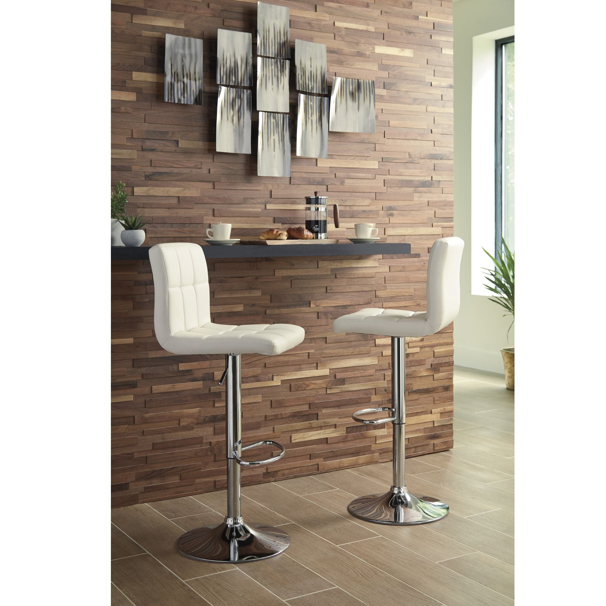 Cream Bellatier Tall UPH Swivel Bar Stool by Signature Ashley, showcasing a plush upholstered seat and sleek wooden legs.
