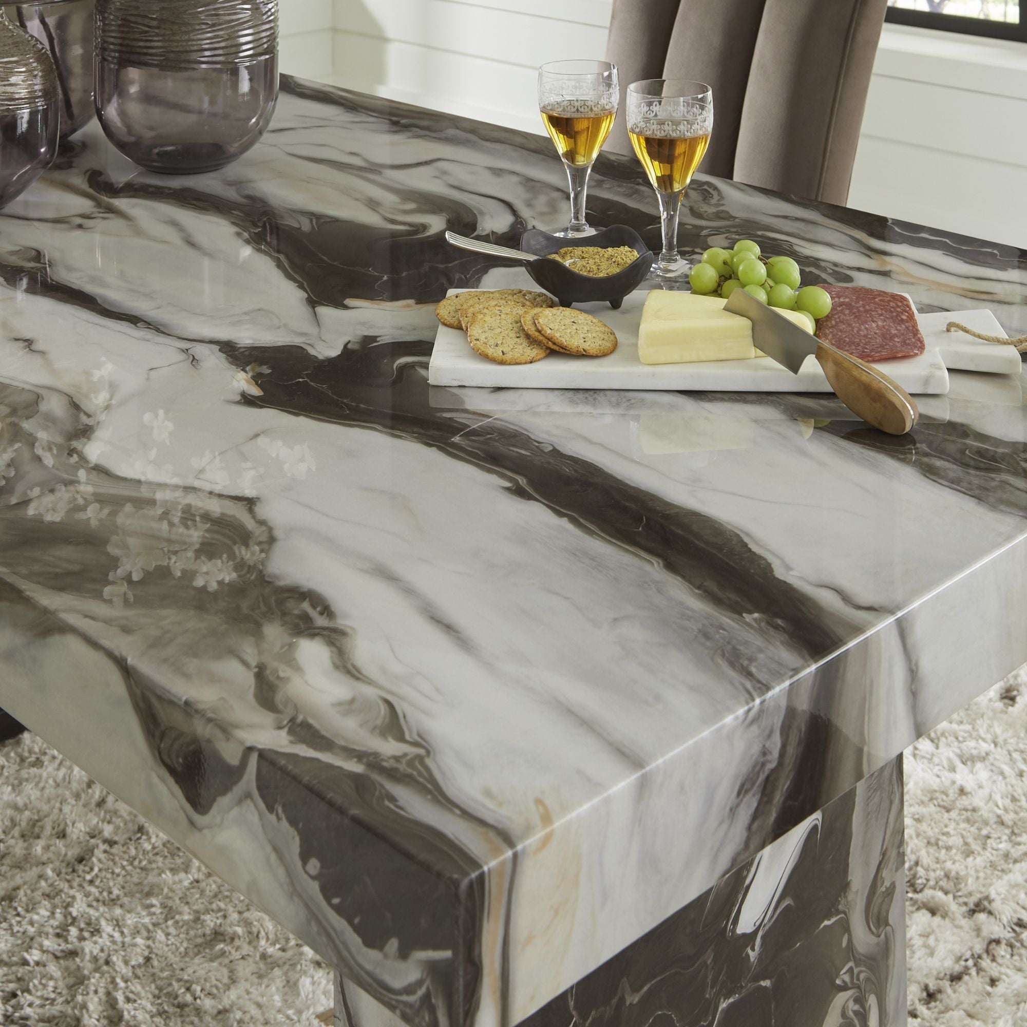 Jeshina Marble Look Dining Room Set by Signature Ashley with a table and matching chairs in a modern design.