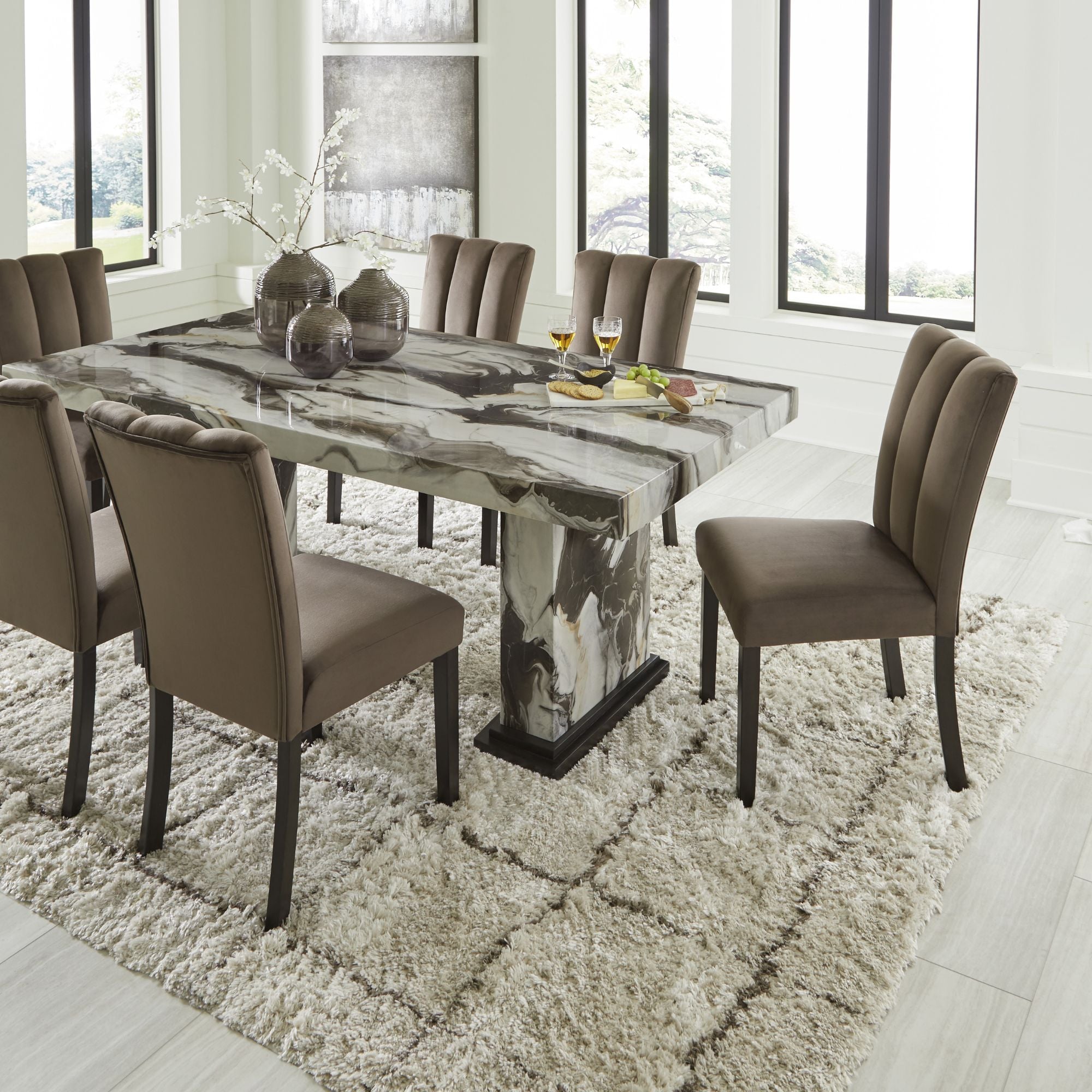 Jeshina Marble Look Dining Room Set by Signature Ashley with a round table and matching chairs in a modern design.