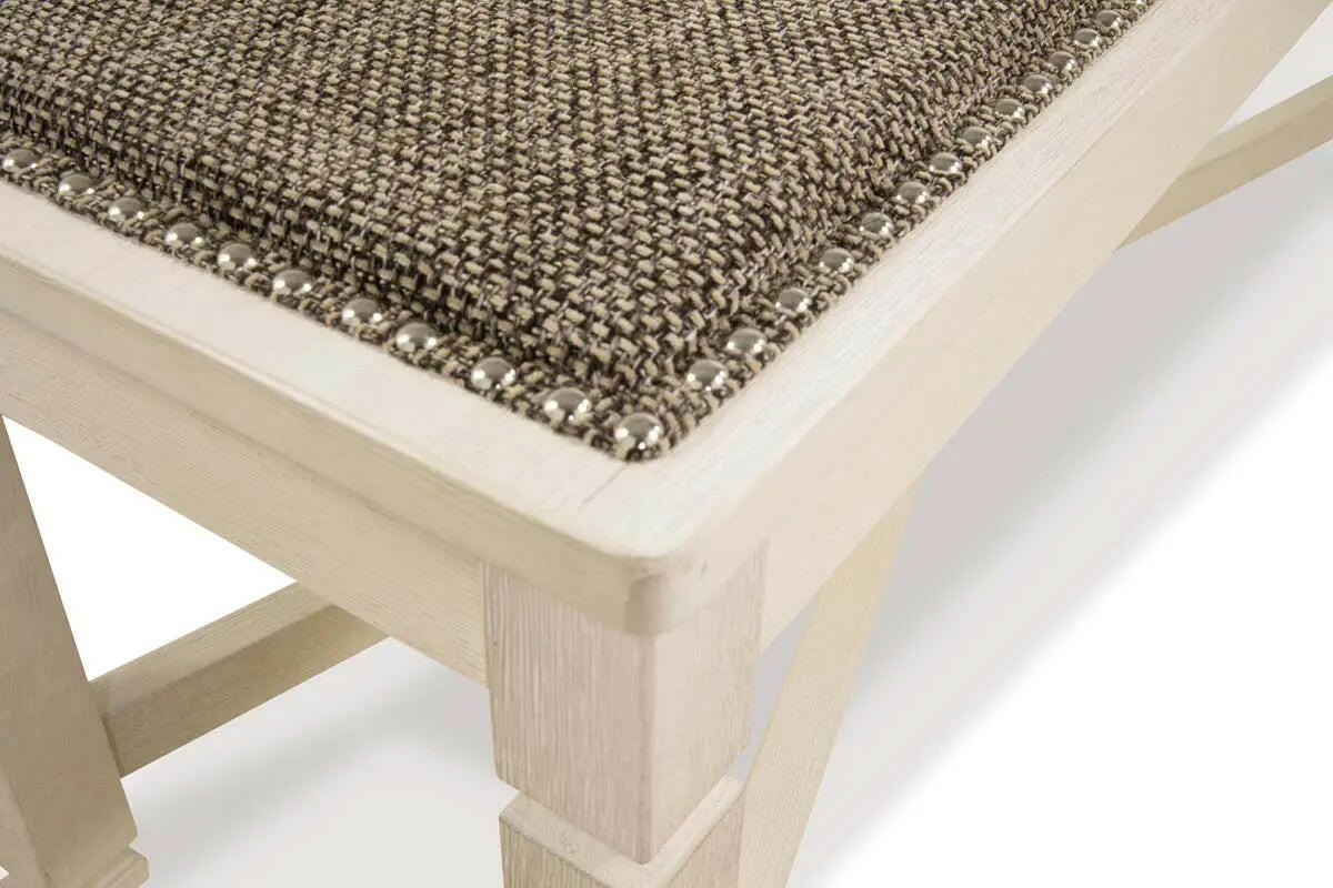 Close-up of the white Bolanburg 6-piece dining room set by Signature Ashley, showing the table surface and chair details.