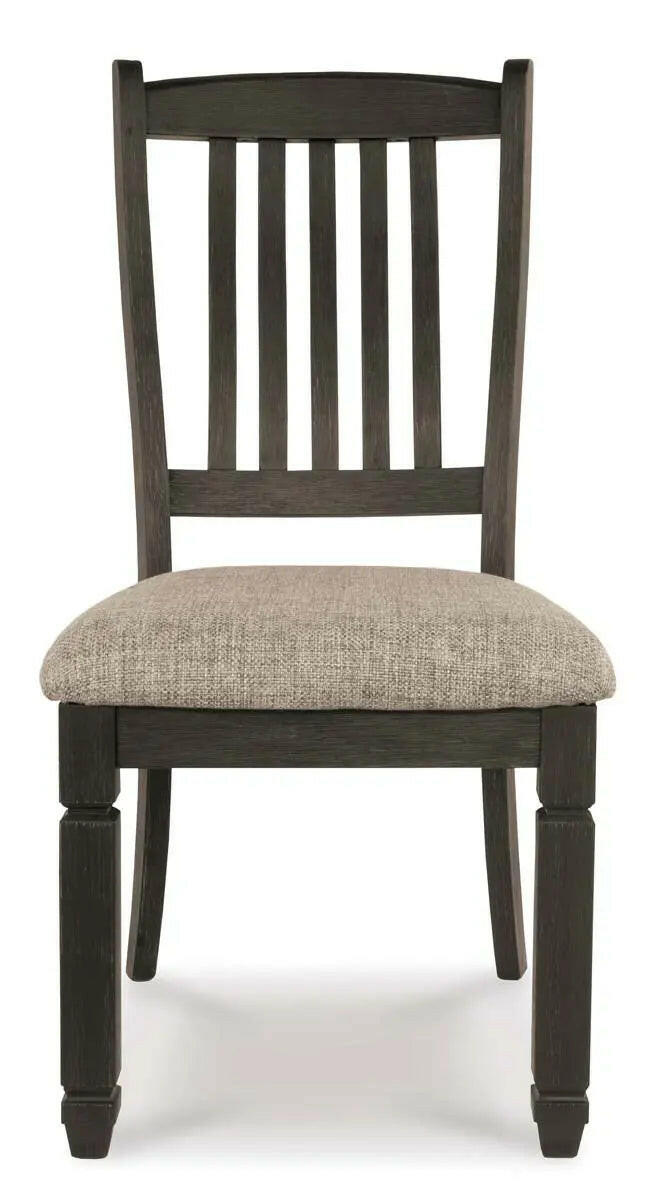 Two-tone Ashley Tyler Creek dining room set with rectangular table and arm chairs, featuring a modern, stylish design.