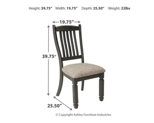 Tyler Creek two-tone dining room set with arm chairs, featuring a stylish wooden table and matching upholstered arm chairs.