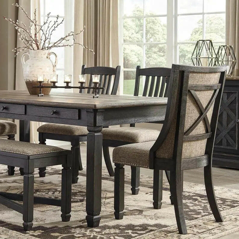 Signature Ashley Tyler Creek two-tone dining room set with arm chairs, featuring a stylish table and matching upholstered chairs.