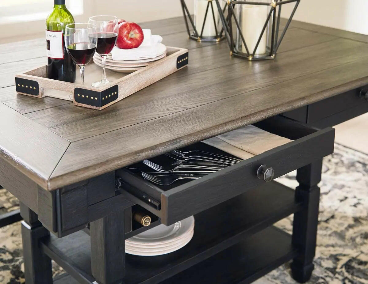 Counter height dining set with six black and grey chairs and table, showcasing the Tyler Creek Signature Ashley dining room collection.