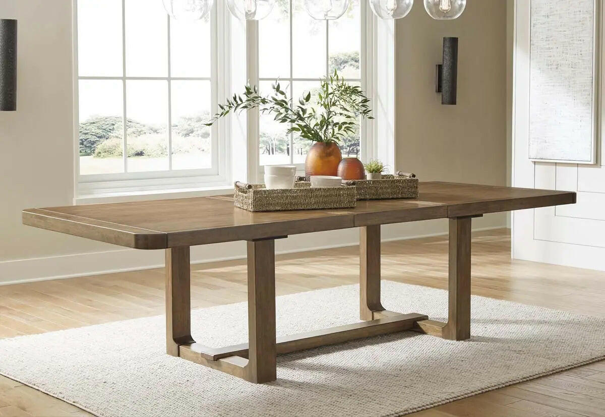 Cabalynn 6-piece brown dining room set by Signature Design Ashley featuring a table with a leaf extension and matching chairs.