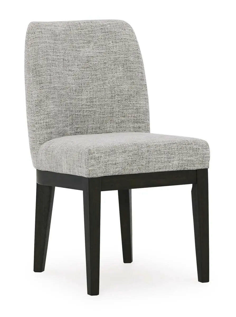 Dark brown Ashley Burkhaus EXT dining room set with arm chairs, featuring a modern table and comfortable seating arranged in a dining space.