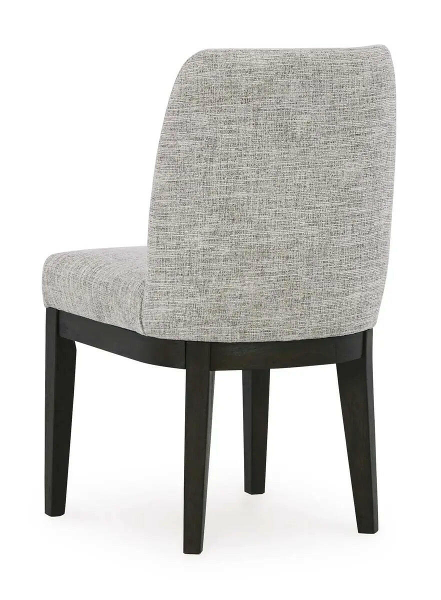 Dark brown Ashley Burkhaus EXT dining room set with arm chair, viewed from the back, featuring a sleek wooden design.