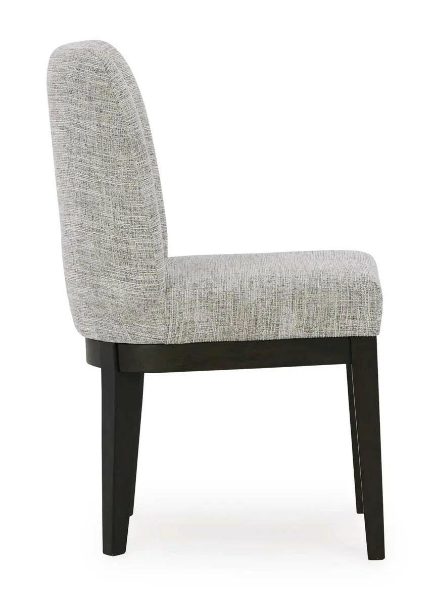 Dark brown Ashley Burkhaus EXT dining room set with arm chair, showcasing the table and seating arrangement.