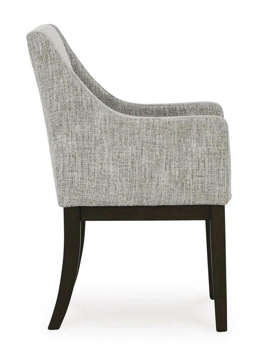 Dark brown Ashley Signature dining room set with armchair and matching table, featuring a modern design in a contemporary dining space.