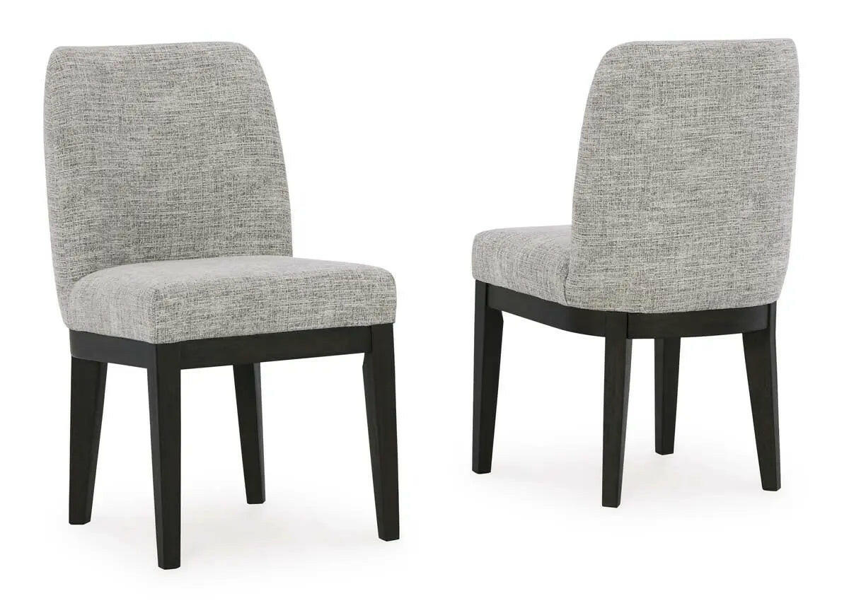 Dark brown Ashley Signature dining room set with armchair, featuring a sturdy table and comfortable upholstered chairs.