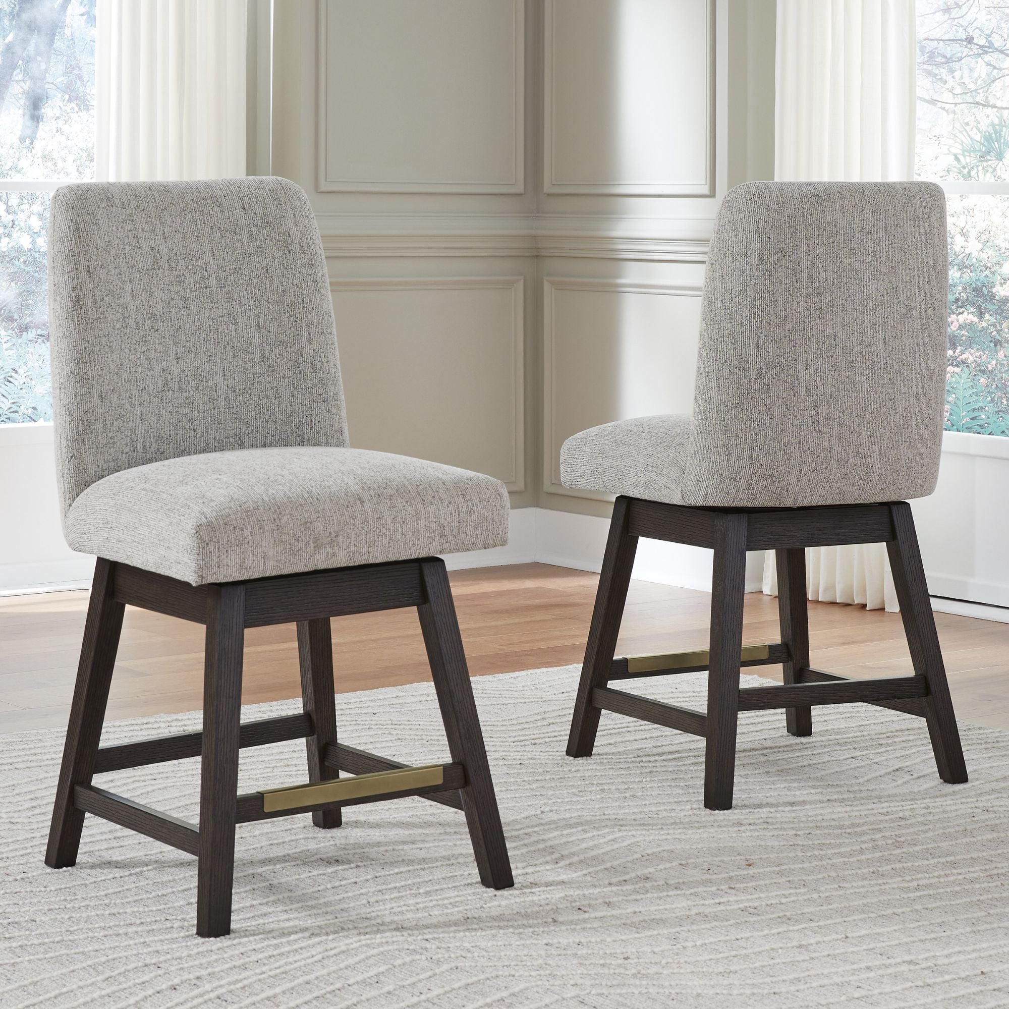 Dark brown Ashley Burkhaus Pub Dining Set with four matching barstools, featuring sturdy wood construction and contemporary design.