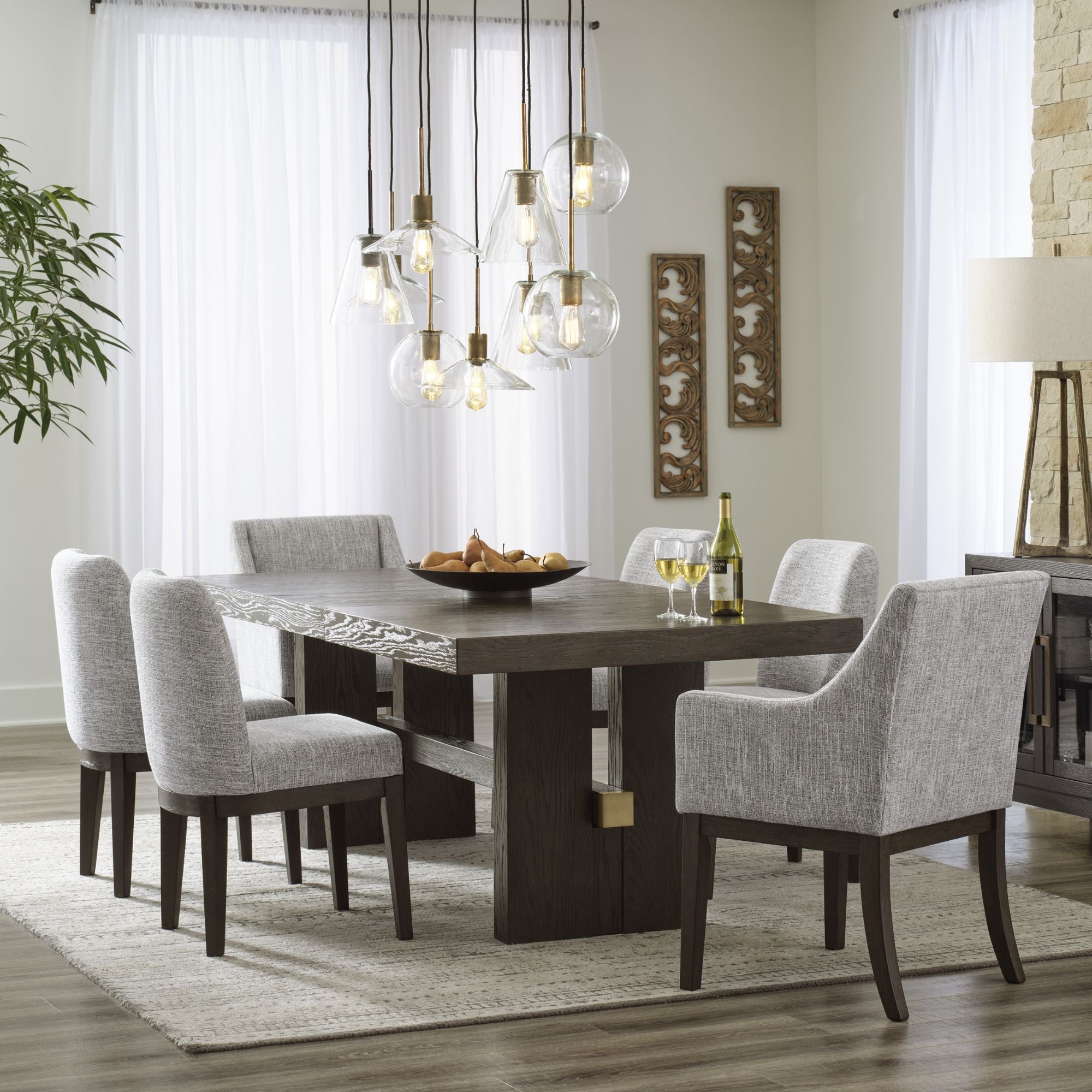 Dark brown Ashley Signature dining room set with armchair, featuring a sturdy table and comfortable seating for a stylish dining space.