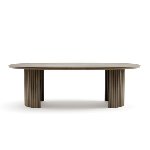 Sculptural 96-inch oval mango wood dining table by Brassex with a smooth, polished surface and sturdy wooden legs.