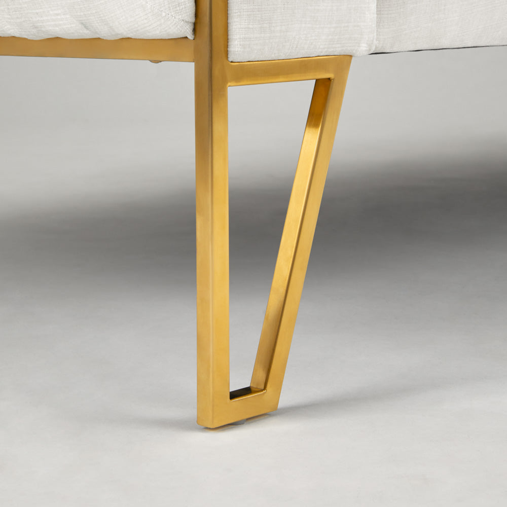 Xcella Truro Sofa in matte gold with ivory upholstery, showcasing elegant design and plush cushioning.
