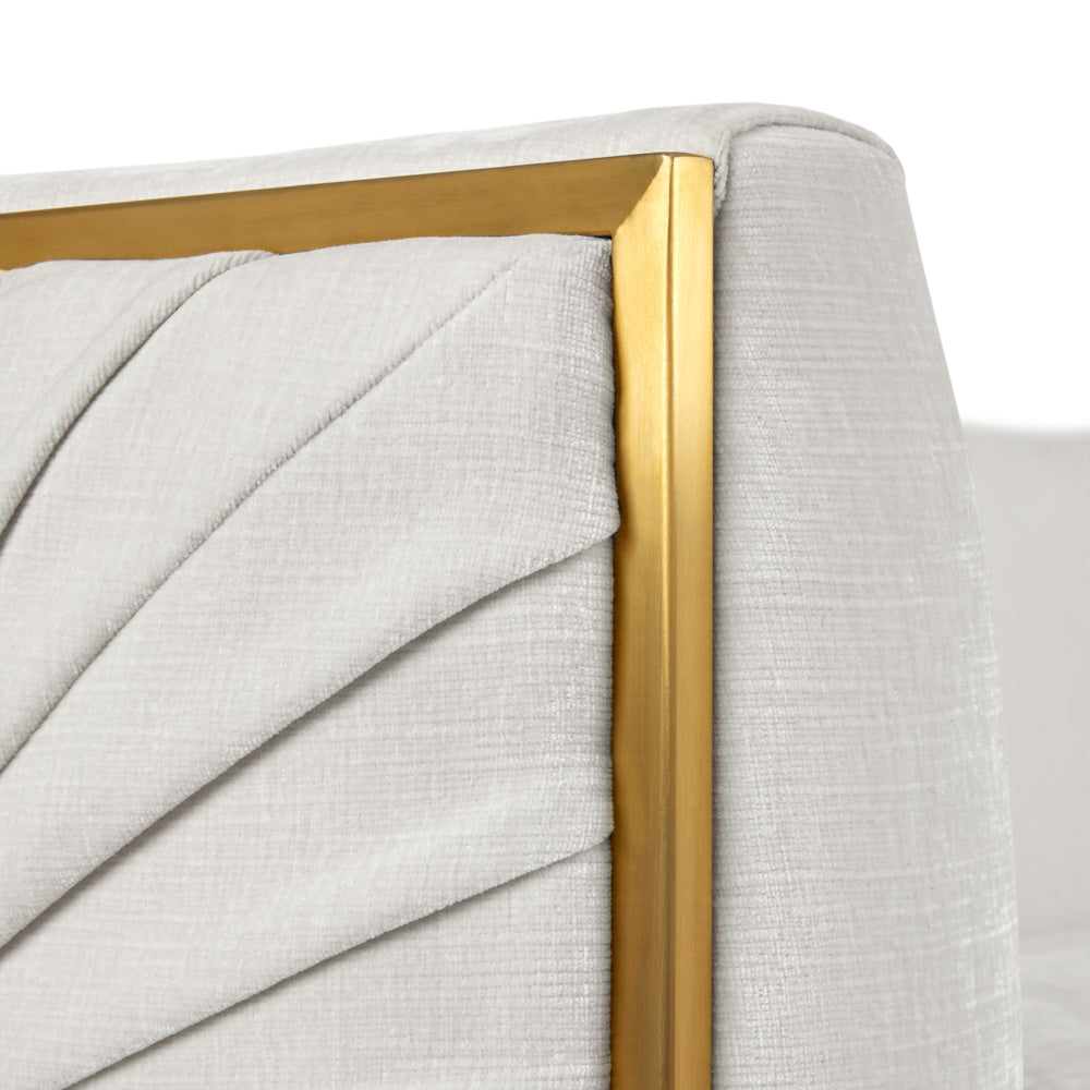 Xcella Truro Sofa in matte gold with ivory upholstery, showcasing elegant design and plush cushioning.
