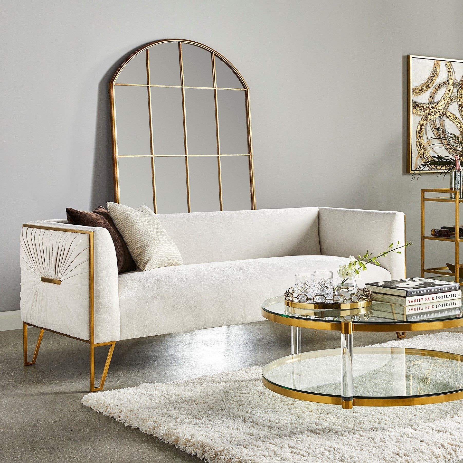 Xcella Truro Sofa in matte gold, modern living room with stylish gold sofa and cozy decor, lifestyle setting.