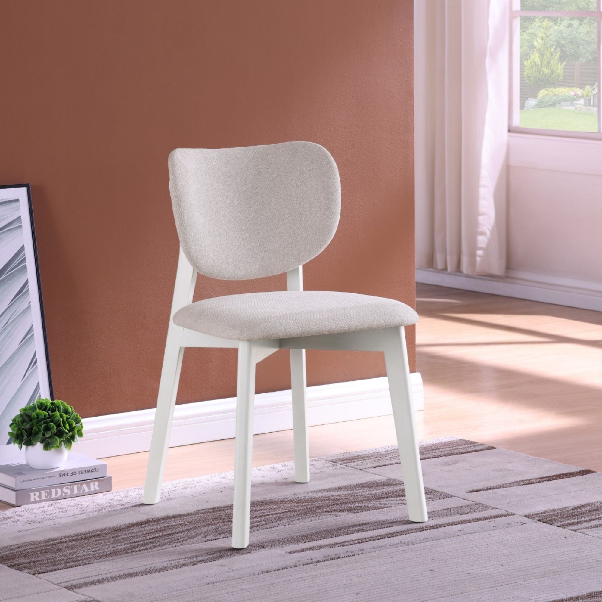 Set of two Brassex Durana dining chairs with wooden legs and upholstered seats, shown from a side and front view.