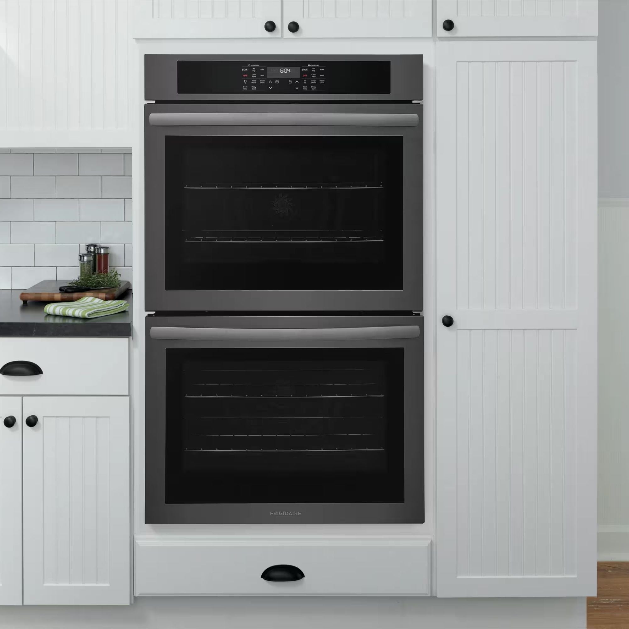 Frigidaire 30-inch double wall oven with air fry in black stainless steel, showcasing the sleek interior and control panel.