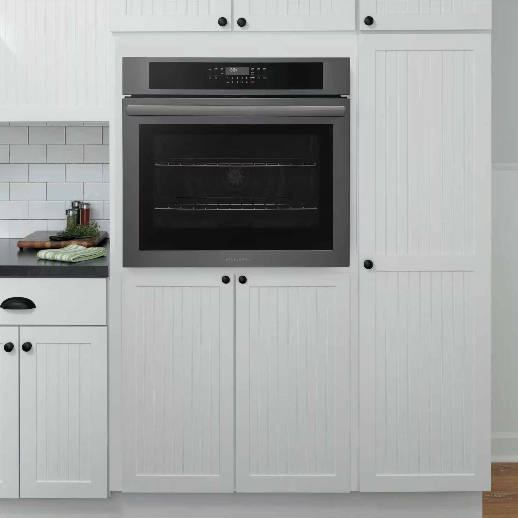 Frigidaire FCWS3030AD 30-inch black stainless steel single wall oven with air fry feature, shown from the front with digital controls.