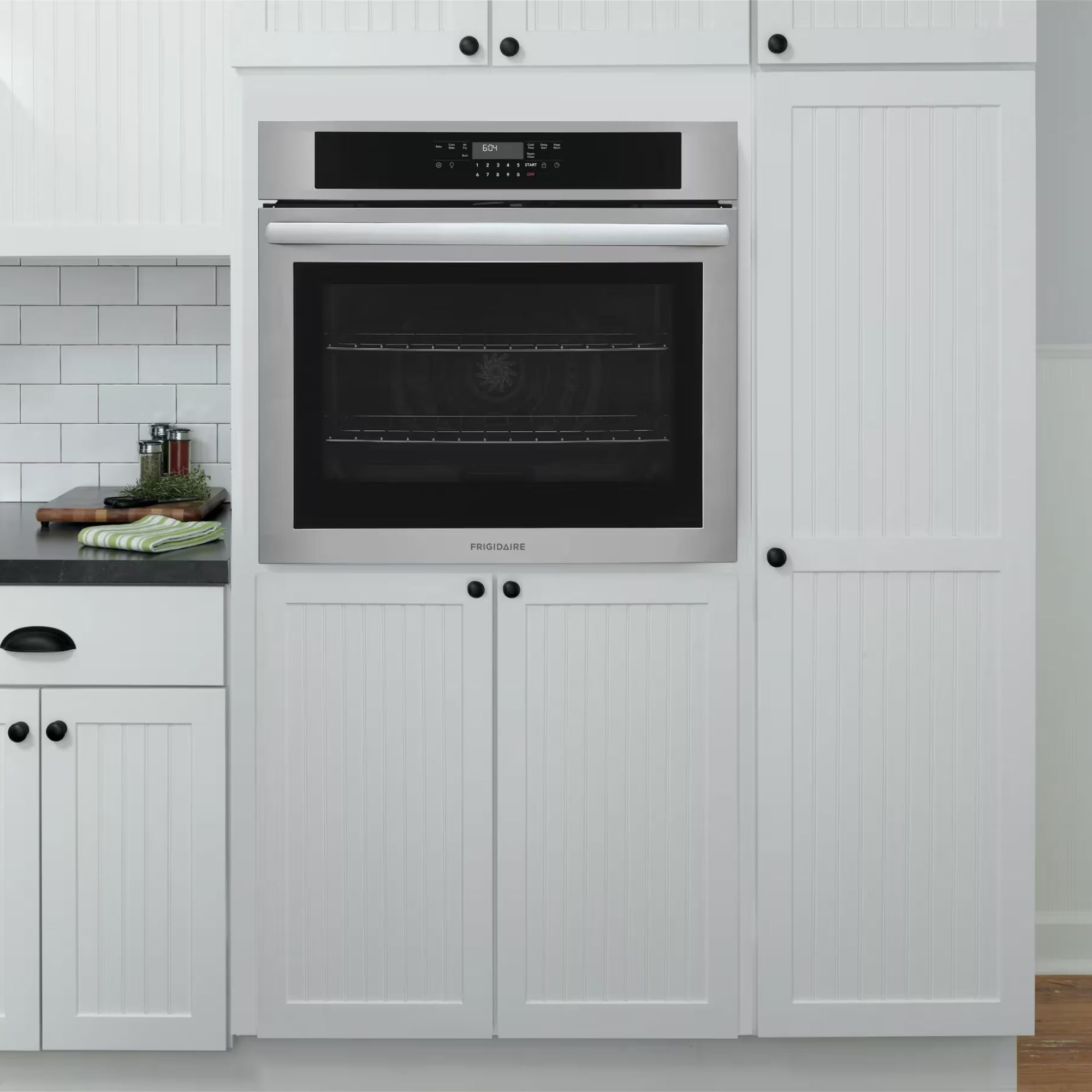 Frigidaire 30-inch stainless steel single wall oven with air fry function, modern design and digital control panel.